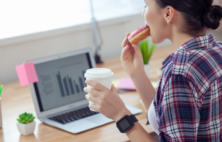 female worker is snacking in office