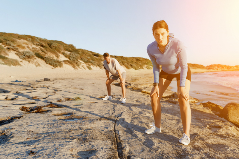 couple running and taking a break