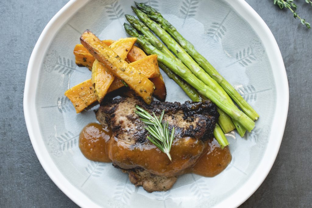 Blackened chicken with asparagus spears and rutabaga fries