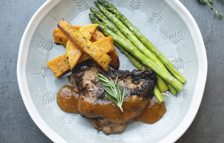 Blackened chicken with asparagus spears and rutabaga fries