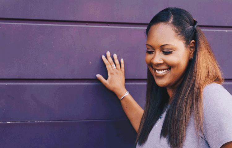 Woman Against Purple Wall